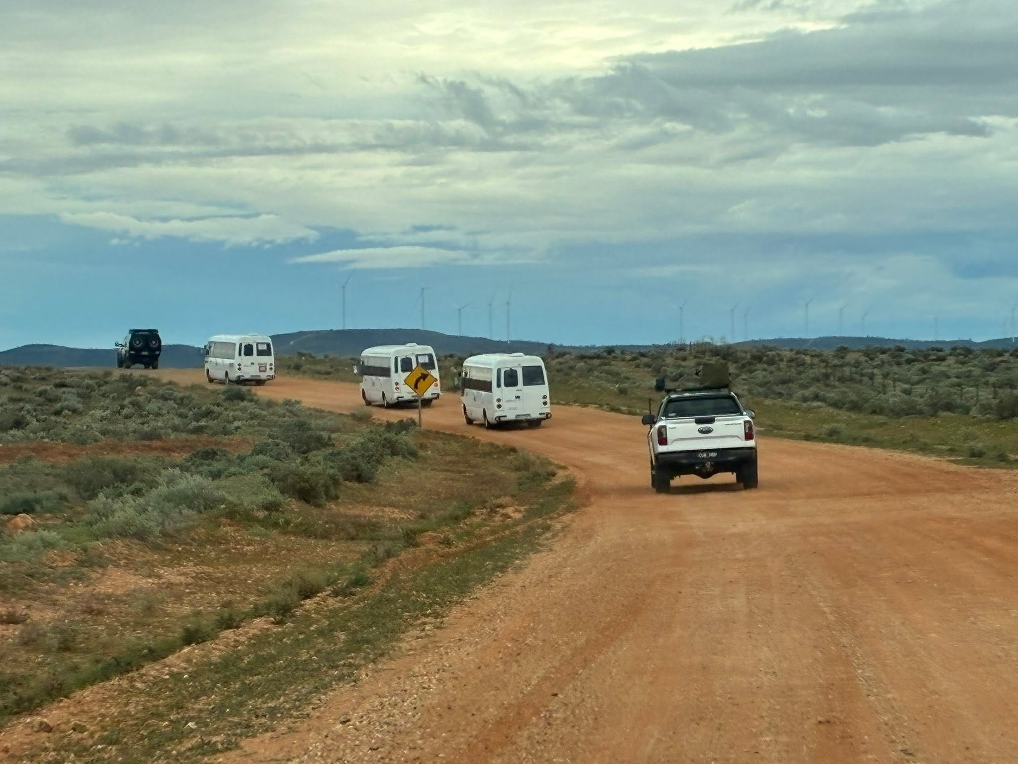 Uluru expedition convoy on a red dirt road