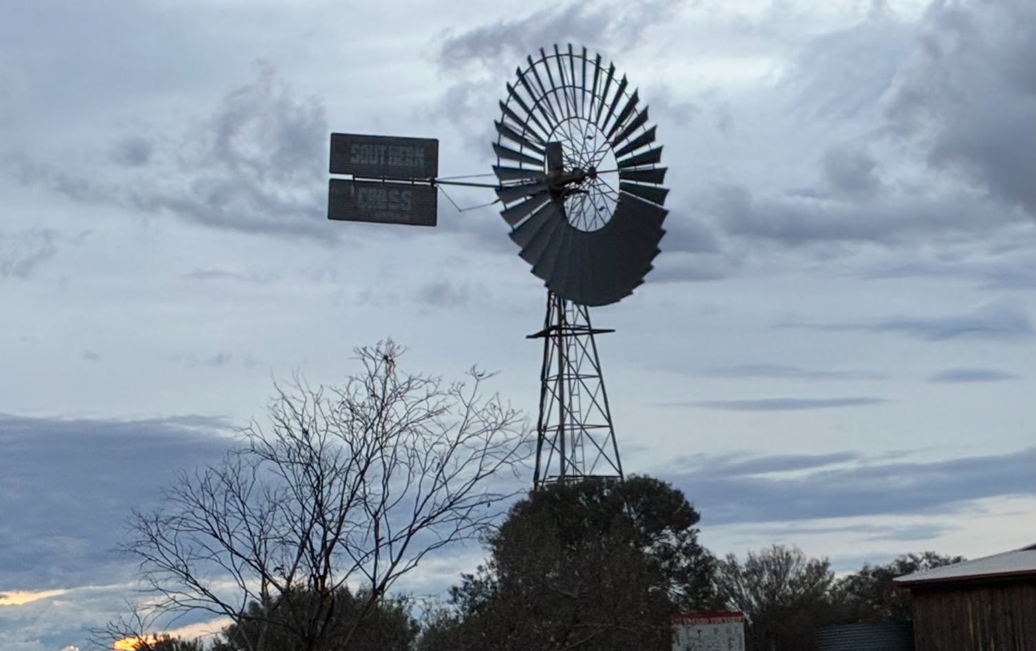 Southern Cross windmill under cloudy skies during the Uluru expedition