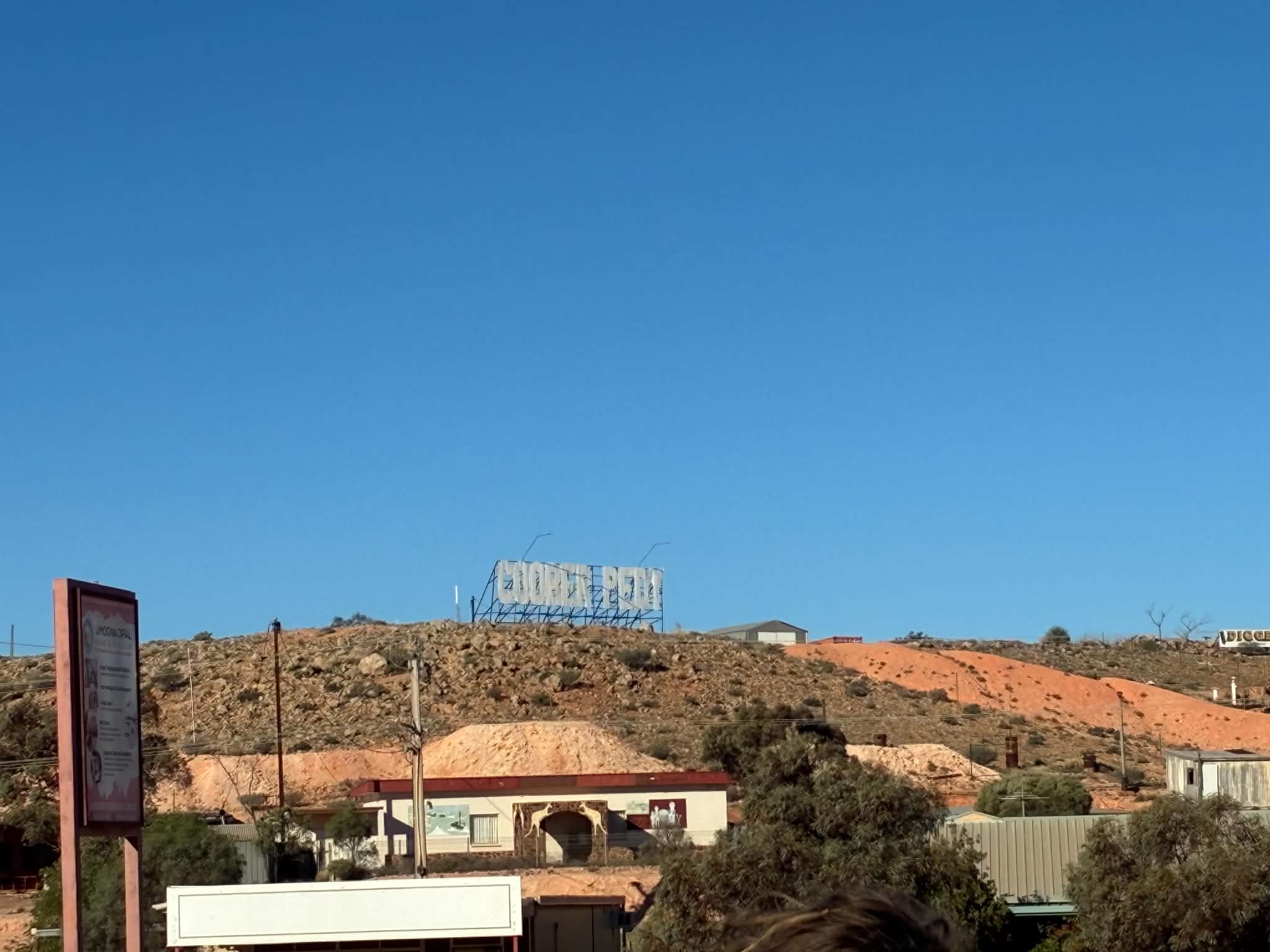 Coober Pedy sign on a hillside above the town during the Uluru expedition