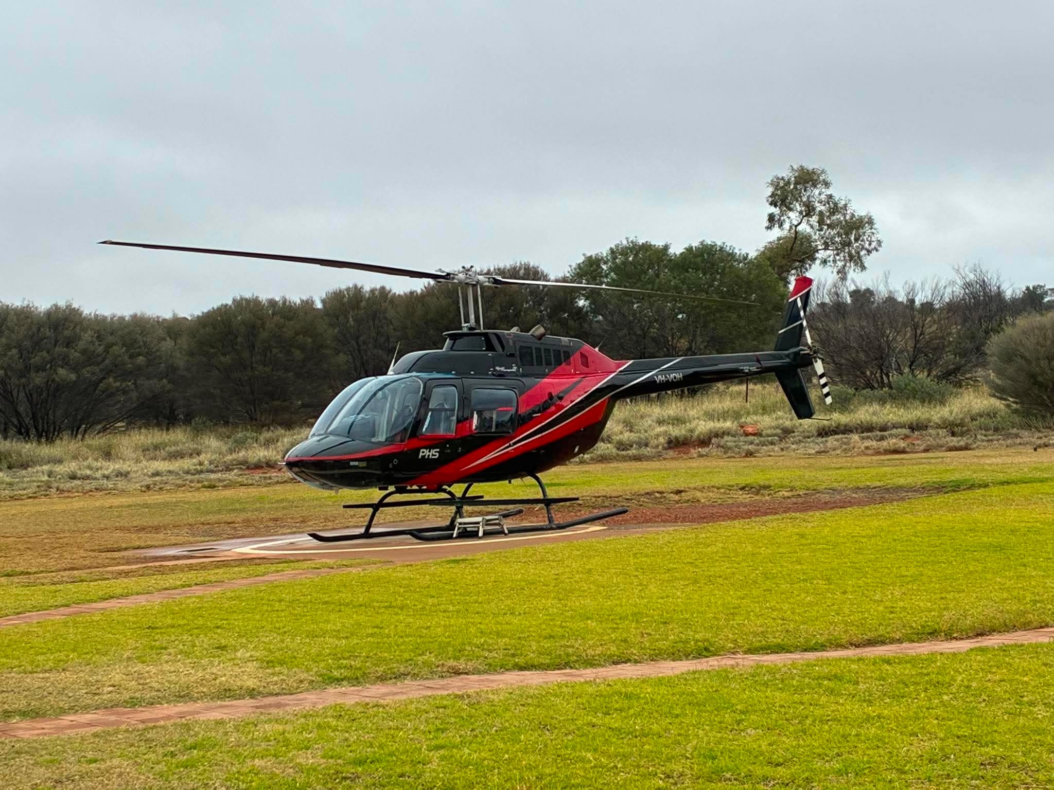 Helicopter waiting on the helipad during the Uluru expedition