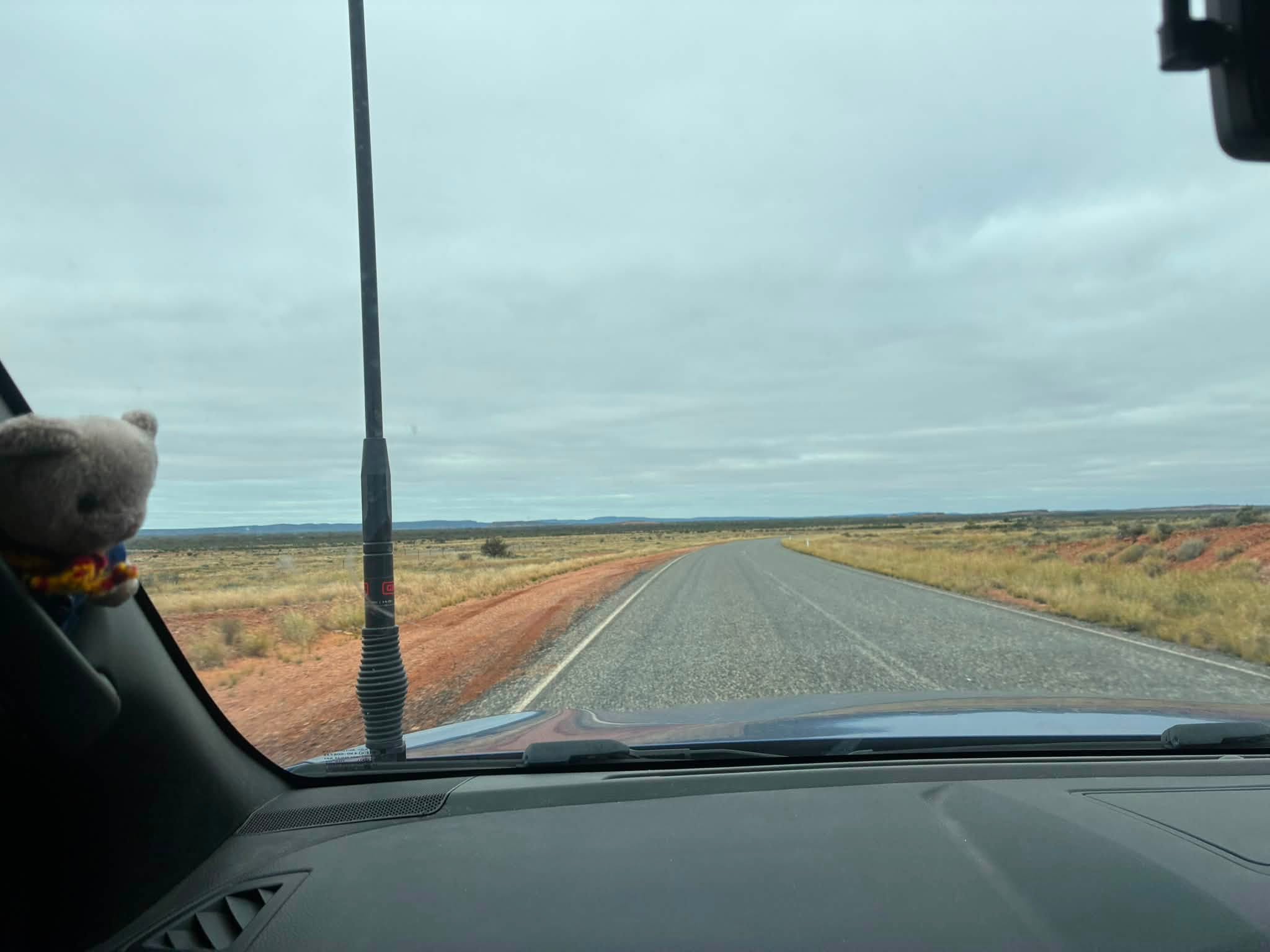 Uluru expedition vehicle travelling along the road towards Alice Springs